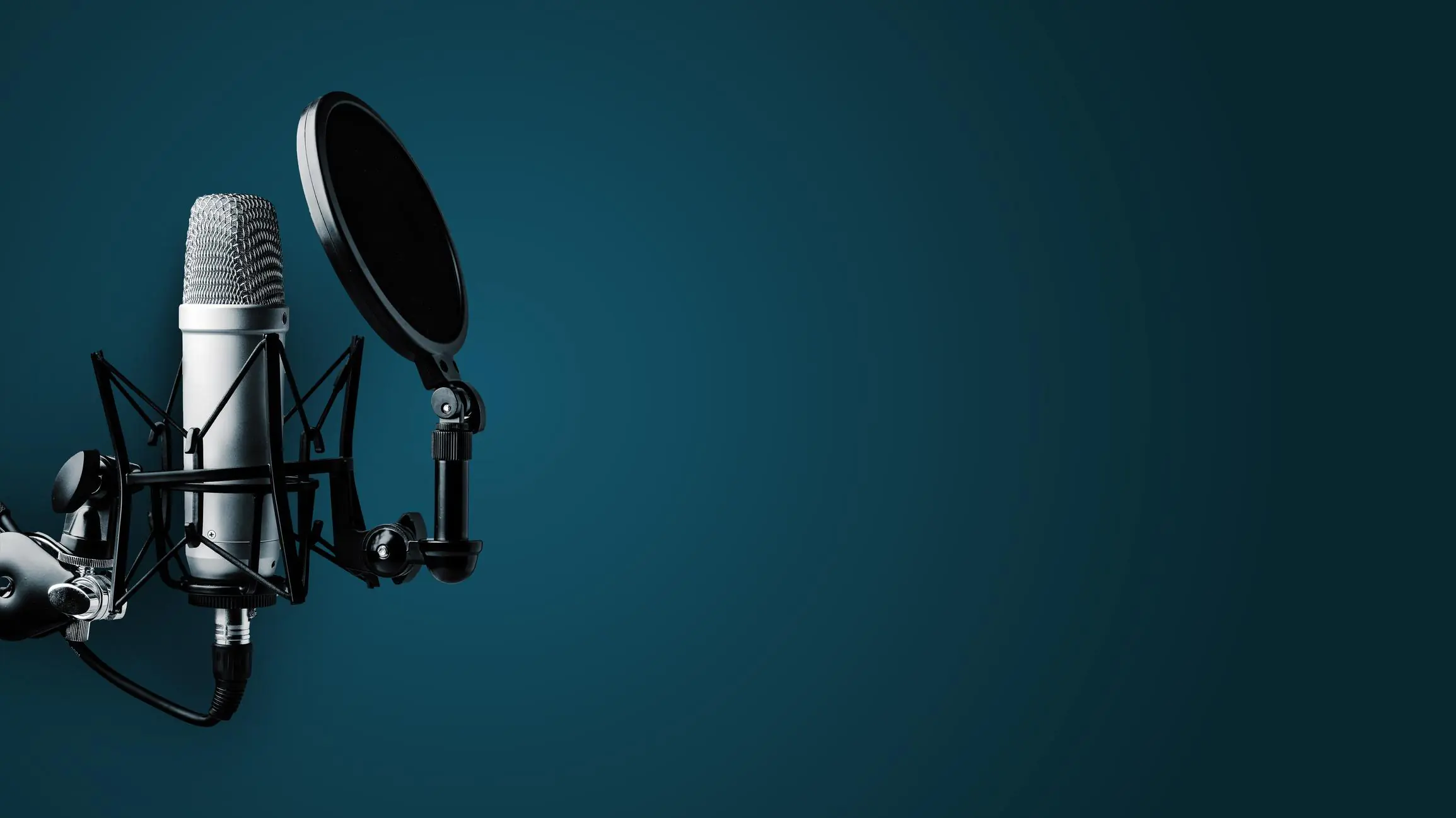 Podcast Audio Visual Services studio with acoustic panels and proper microphone placement for controlled podcast recording clarity.
